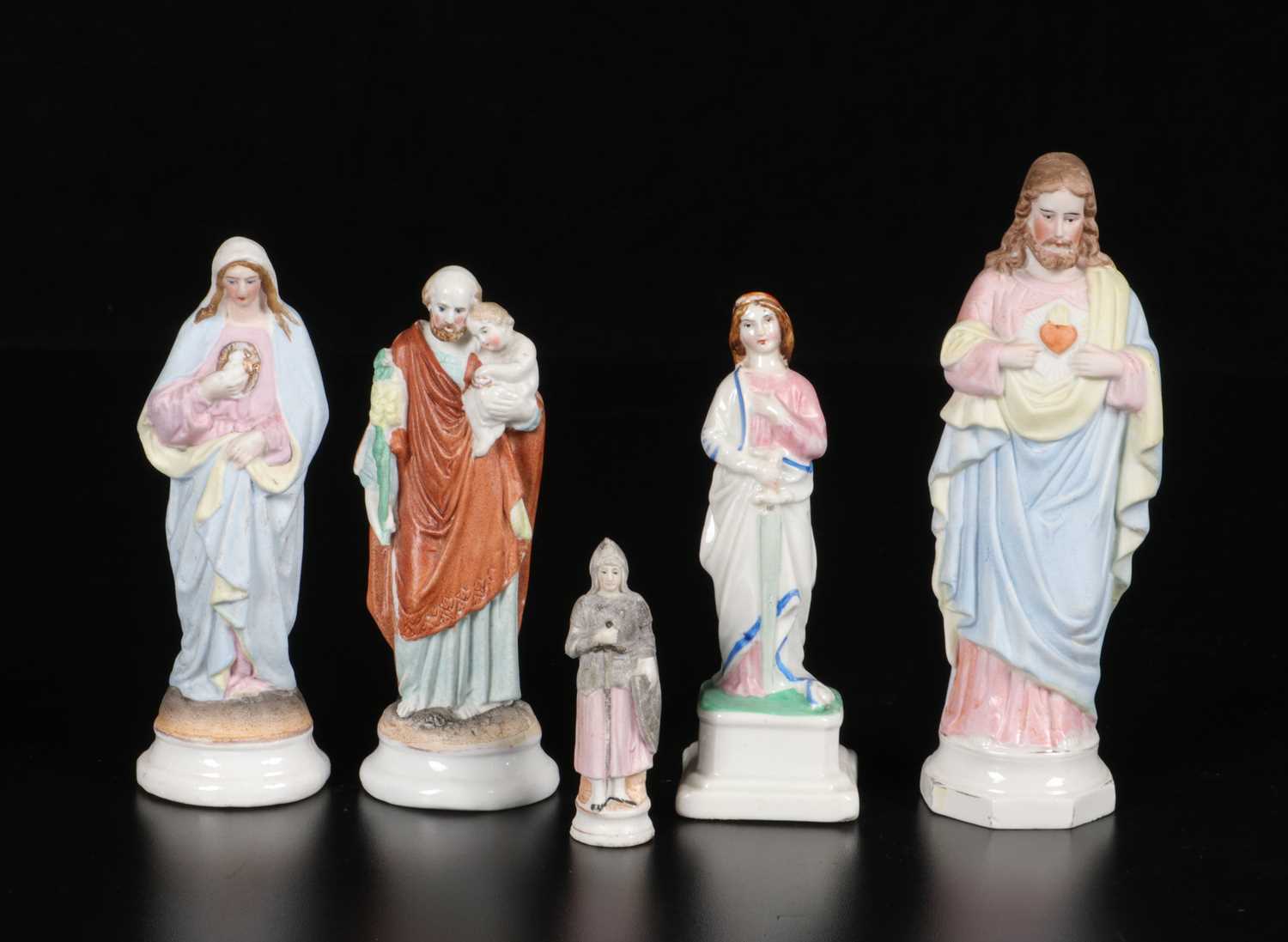 Lot 82 - Five Polychrome Religious Figures in Porcelain and Ceramic