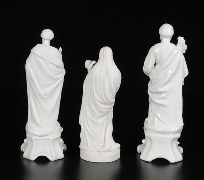 Lot 84 - Three Porcelain Figures of Saints and Madonna with Child