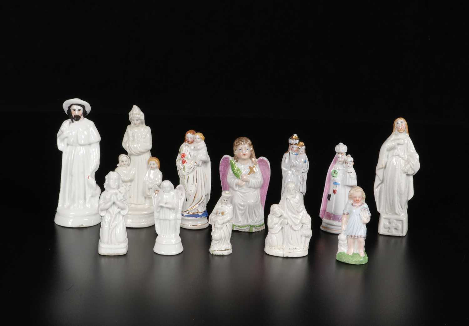 Lot 86 - Twelve Small Porcelain Religious Figures of Saints and Angels