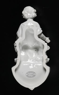 Lot 92 - Porcelain Holy Water Font Depicting the Infant Christ, by Petrus Regout