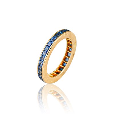 Lot 77 - Gold Eternity Ring with Sapphire