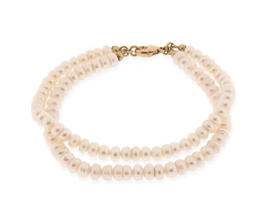Lot 711 - Two-Strand Pearl Bracelet with Gold Lock