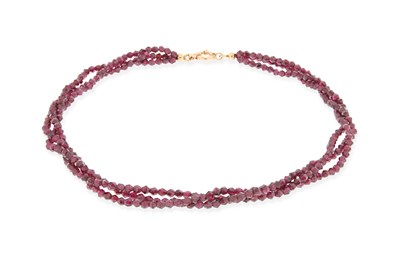 Lot 647 - 3-Strand Garnet Necklace with 14K Gold Lock