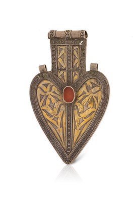 Lot 214 - A Partly Fire-Gilded Silver and Carnelian Cordiform Dorsal Ornament.