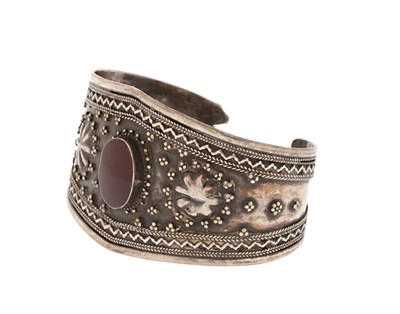Lot 152 - A Fire-Gilded Silver and Carnelian ‘Bilezik’ Cuff Bracelet.