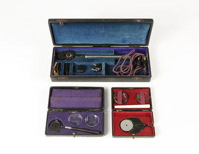 Lot 827 - Two Retinoscopes, and one Ophthalmoscope, 19th/20th century.