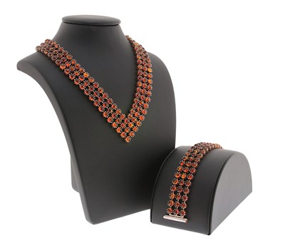 Lot 603 - ‘V’-Shaped Eternity Necklace and Bracelet set with Amber