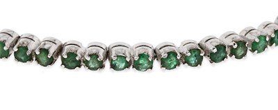 Lot 25 - Silver Eternity Bracelet set with Emerald