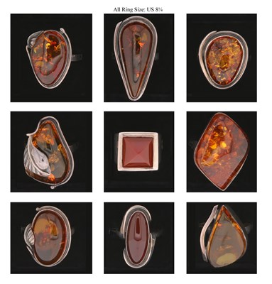 Lot 227 - Nine Silver Rings all set with Amber and Carnelian