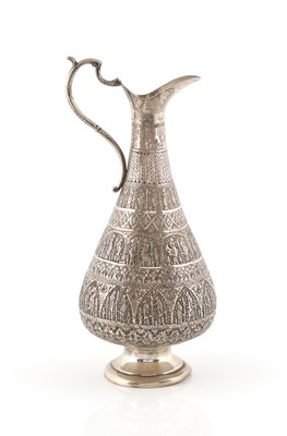 Lot 104 - A Persian Repoussé Silver Jug