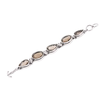 Lot 558 - Faceted Smoky Quartz and Silver Bracelet