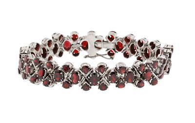 Lot 544 - A Facet Cut Garnet Bracelet