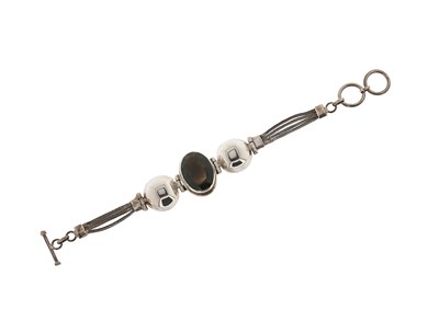 Lot 557 - Sterling Silver and Smoky Quartz Bracelet