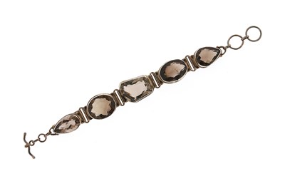 Lot 561 - A Smoky Topaz and Silver Bracelet