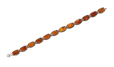 Lot 578 - A Silver and Amber Bracelet