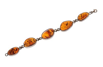 Lot 579 - A Sterling Silver and Amber Bracelet