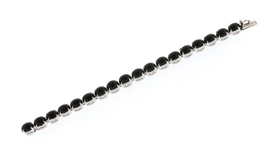 Lot 570 - A Silver and Onyx Bracelet