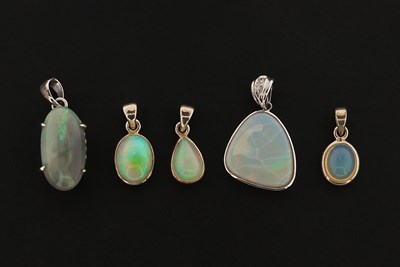 Lot 654 - Five Sterling silver Pendants set with Opal