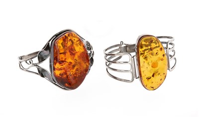 Lot 581 - Two Amber and Silver Bracelets