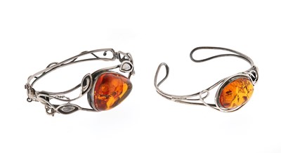 Lot 575 - Two Arts and Crafts Style Sterling Silver and Amber Bracelets