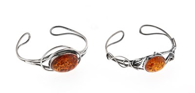 Lot 577 - Two Arts and Crafts Style Amber and Silver Bracelets