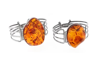 Lot 574 - A Pair of Amber and Silver Bracelets