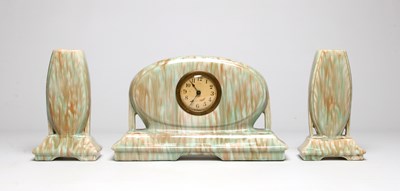 Lot 839 - An Art Deco Style Ceramic Mantel Clock with Two Vases