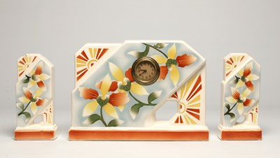 Lot 840 - An Art Deco Style Ceramic Mantel Clock with Two Vases