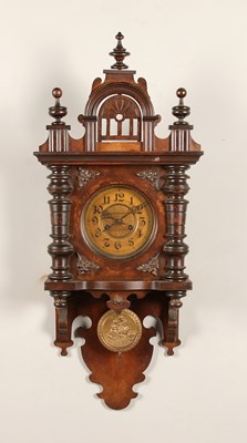 Lot 779 - A German Walnut Wall Clock