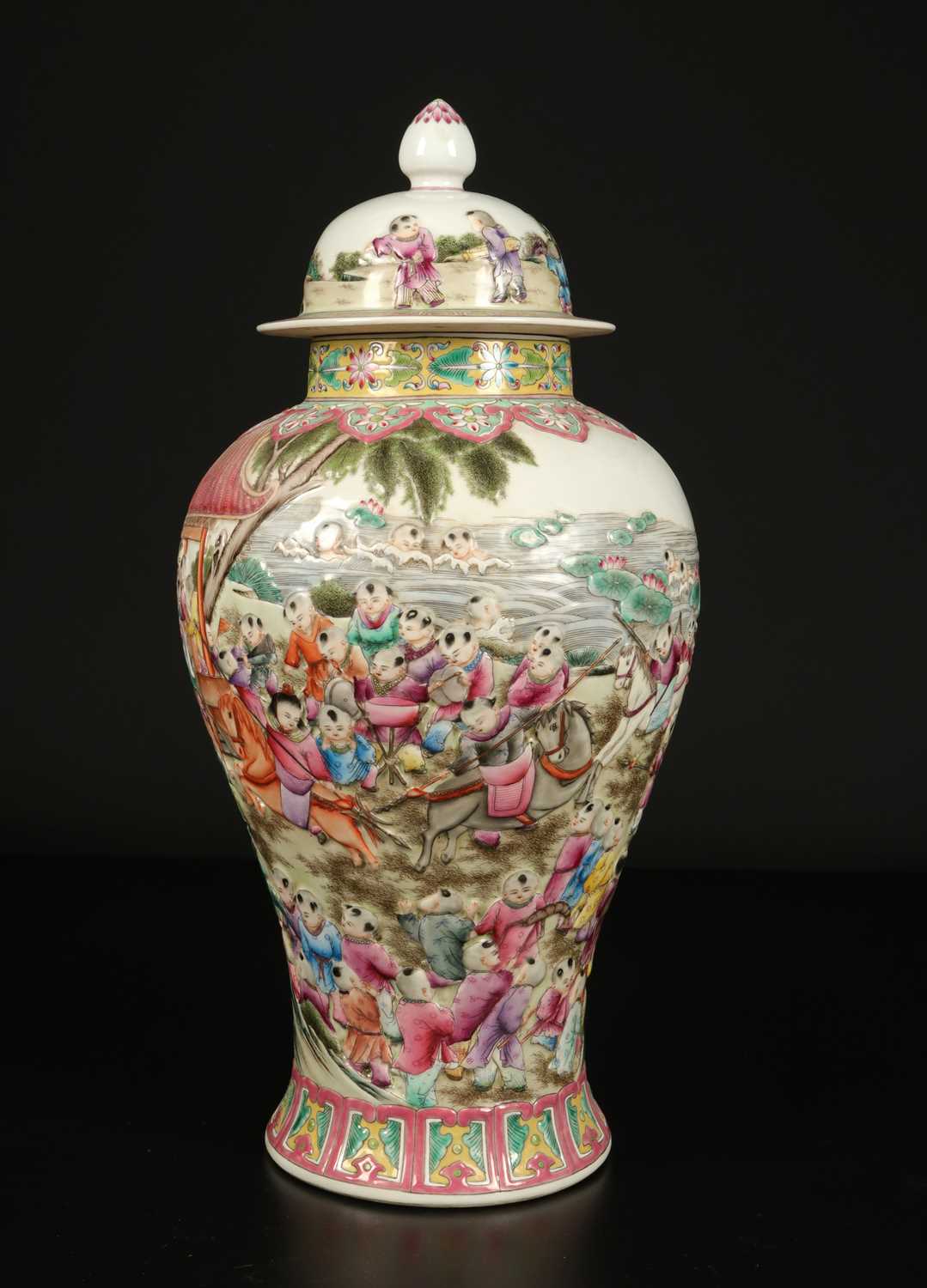 Lot 1157 - A Chinese "Playful Boys" Famille-Rose Relief-Molded Vase with Cover