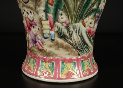 Lot 1157 - A Chinese "Playful Boys" Famille-Rose Relief-Molded Vase with Cover