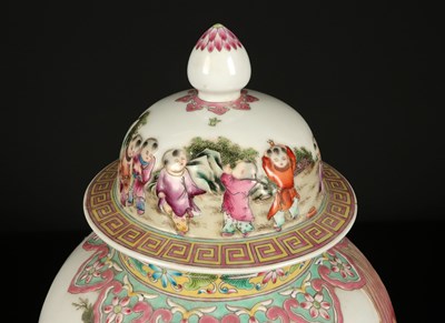 Lot 1157 - A Chinese "Playful Boys" Famille-Rose Relief-Molded Vase with Cover