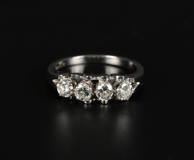 Lot 9 - 14K White Gold Diamond Row Ring