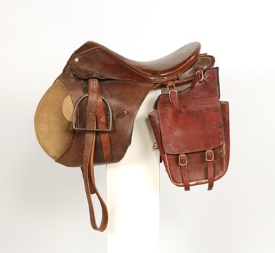 Lot 517 - Leather saddle, with saddle bags and metal stirrups