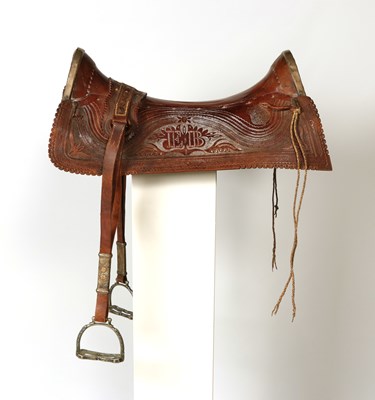 Lot 518 - Leather saddle, with brass mountings, metal stirrups, silver inlay and initials E.B.