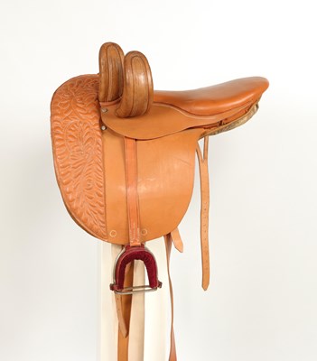 Lot 521 - Leather side saddle lady, with metal stirrups