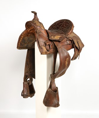 Lot 522 - Antique high back Cuban saddle, with stirrups and saddle bags