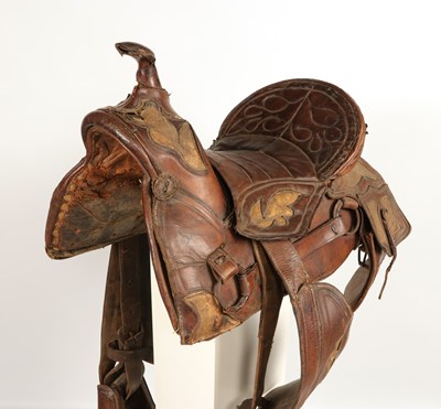 Lot 522 - Antique high back Cuban saddle, with stirrups and saddle bags