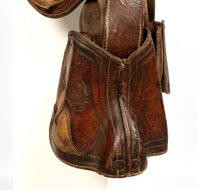 Lot 522 - Antique high back Cuban saddle, with stirrups and saddle bags