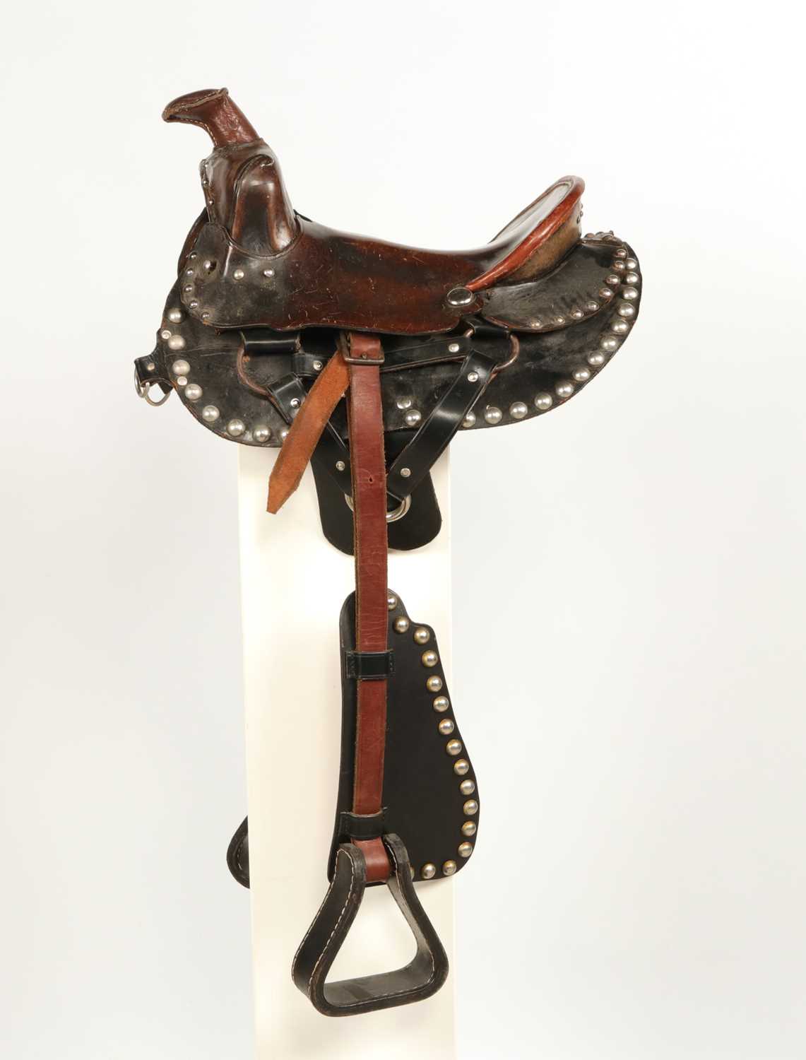 Lot 523 - Leather Childrens Western saddle, with stirrups and decorated with studs