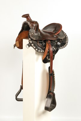 Lot 523 - Leather Childrens Western saddle, with stirrups and decorated with studs