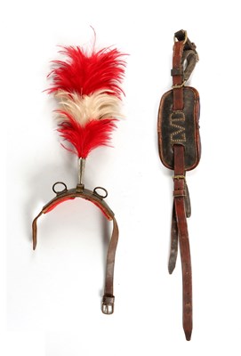 Lot 542 - Two antique dog saddles, one with plume an one with initials L.V.D.