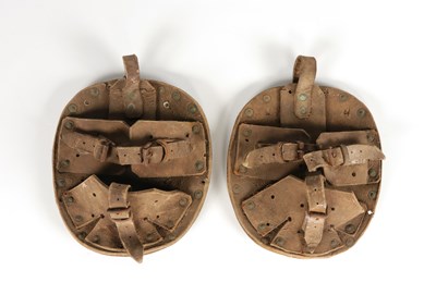 Lot 549 - Two antique leather horse shoes