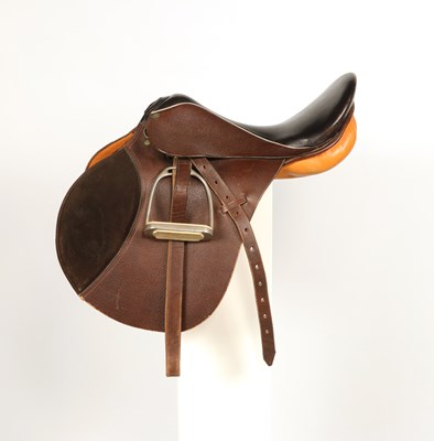 Lot 558 - Leather horse saddle, with metal stirrups