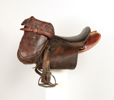 Lot 596 - Military leather horse saddle, with stirrups and saddlebags