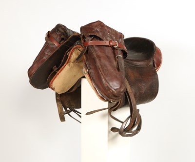 Lot 596 - Military leather horse saddle, with stirrups and saddlebags