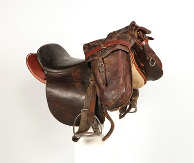 Lot 596 - Military leather horse saddle, with stirrups and saddlebags