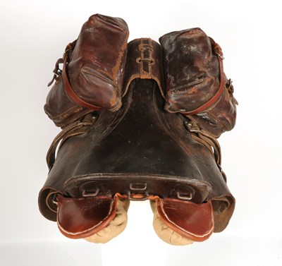 Lot 596 - Military leather horse saddle, with stirrups and saddlebags