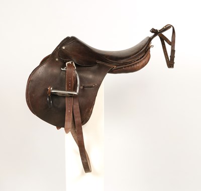 Lot 597 - Military leather horse saddle, with stirrups