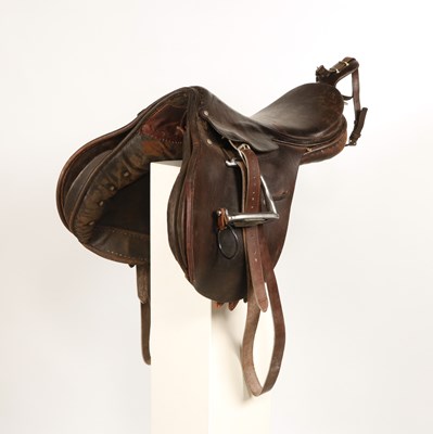 Lot 597 - Military leather horse saddle, with stirrups
